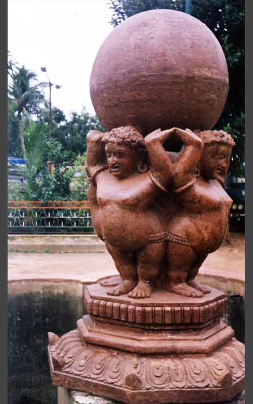 Bhubaneswar Municipal Corporation monument featuring four figures holding the globe