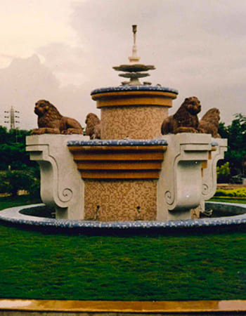 Hotel garden stone sculpture installation creating serene architectural focal point