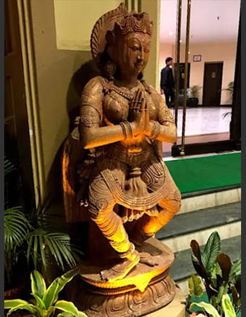 Corporate lobby stone carving featuring intricate architectural details and cultural motifs