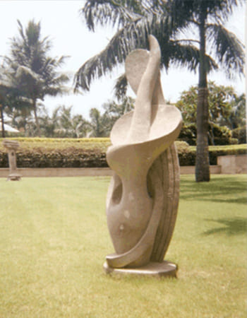 Institutional building stone carving displaying traditional motifs and contemporary design