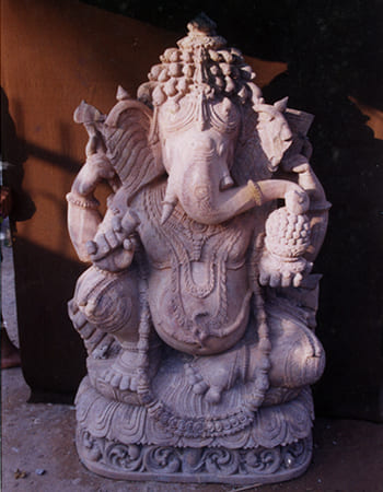 Divine Ganesh statue in blessing pose with detailed elephant features and traditional attire