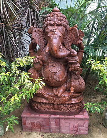 Artistic Lord Ganesha idol with mouse companion and traditional temple sculpture styling