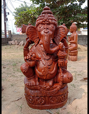 Handcrafted Lord Ganesh idol in meditative pose with lotus pedestal and spiritual symbolism