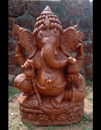 Divine Ganesh statue with protective aura and detailed sandstone craftsmanship for home blessing