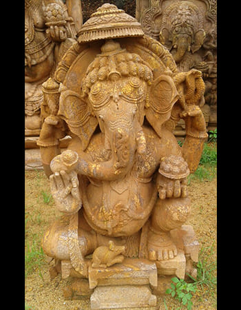 Divine Ganesh statue with protective mudra and ornamental base design for spiritual harmony
