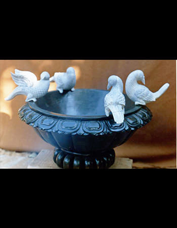 Traditional green stone artwork showcasing classical Indian dance with expressive gestures