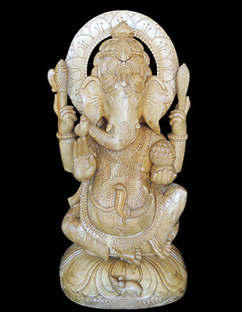 Wooden architectural detail with temple-inspired carvings and cultural significance